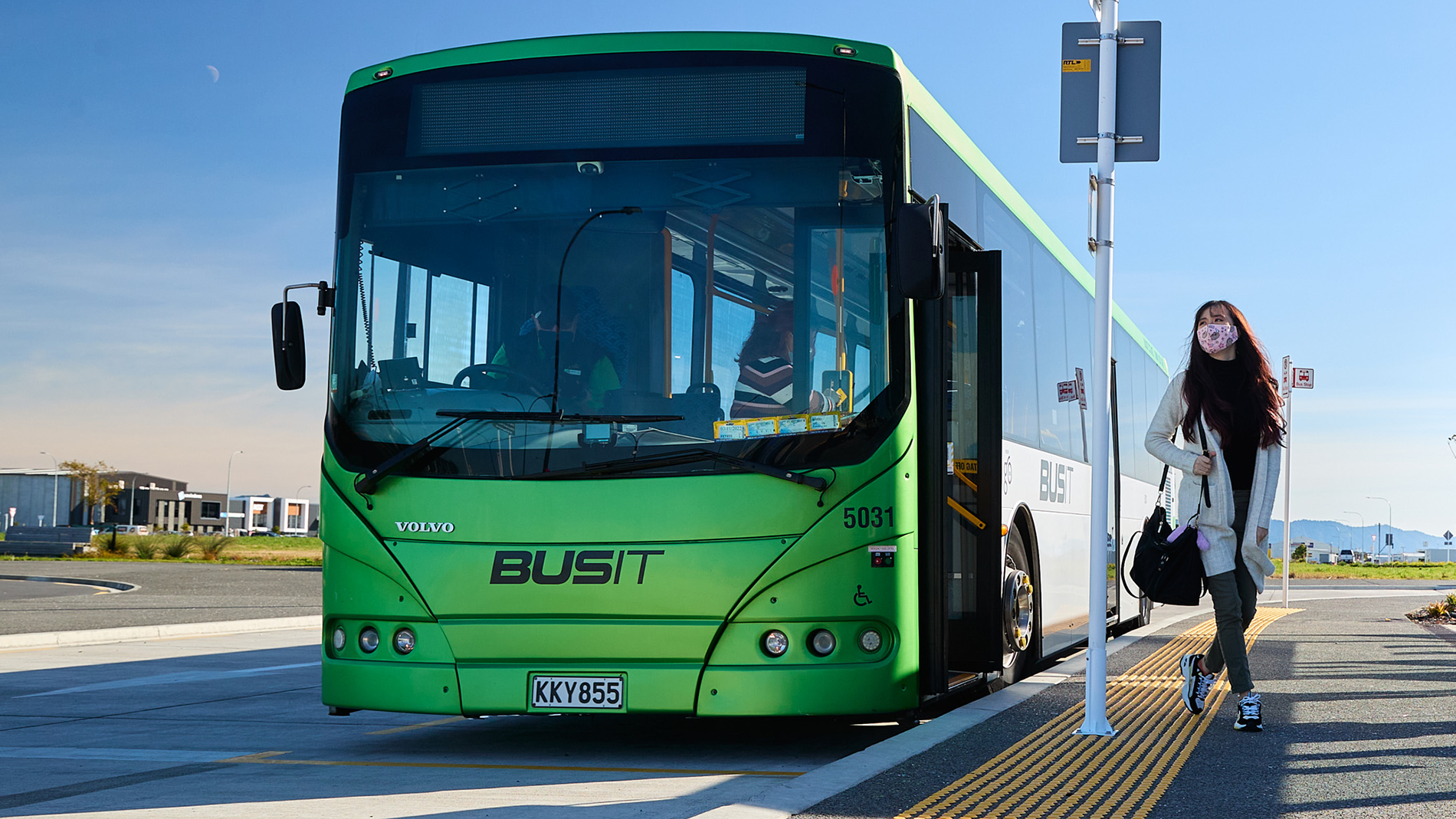 Bus user at bus stop