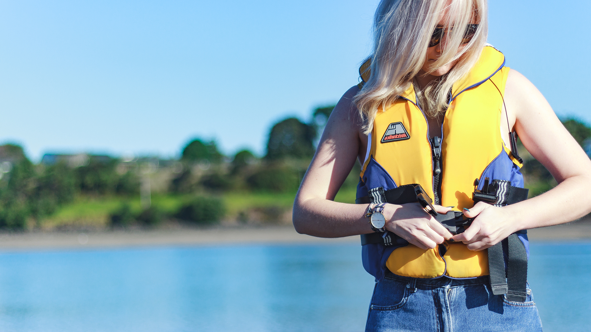 Image - Photo of person putting on lifejacket