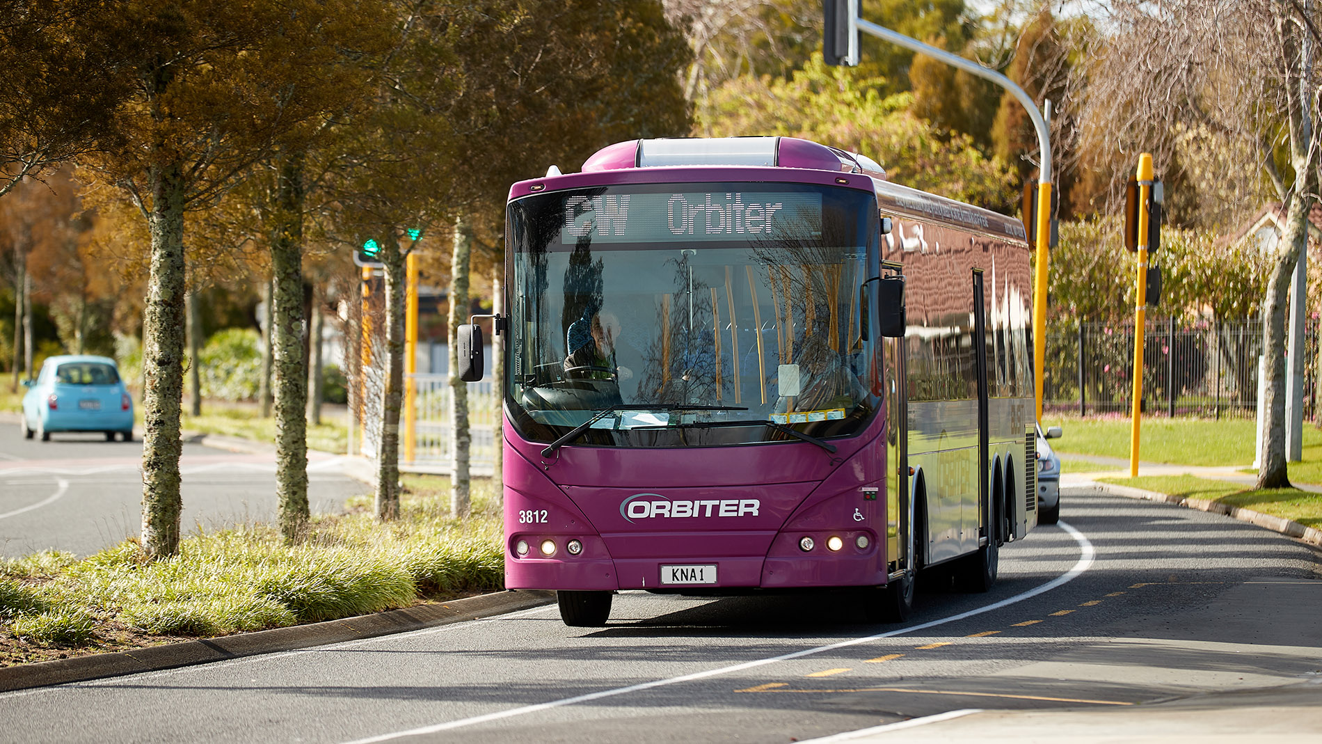 Image of a purple CW Orbiter bus on the road