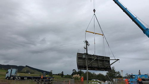 Old Lake Waikare control gate removed and in the air. Ready to be loaded for transporting