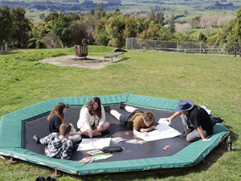 Group of youth sitting on the ground