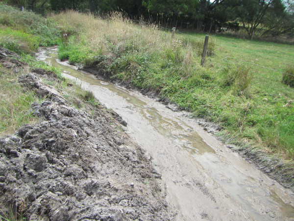 Sediment laden stream following earthworks.