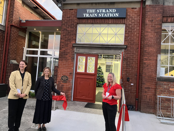 Ribbon cutting ceremony outside the entrance to the new Auckland railway station building. 